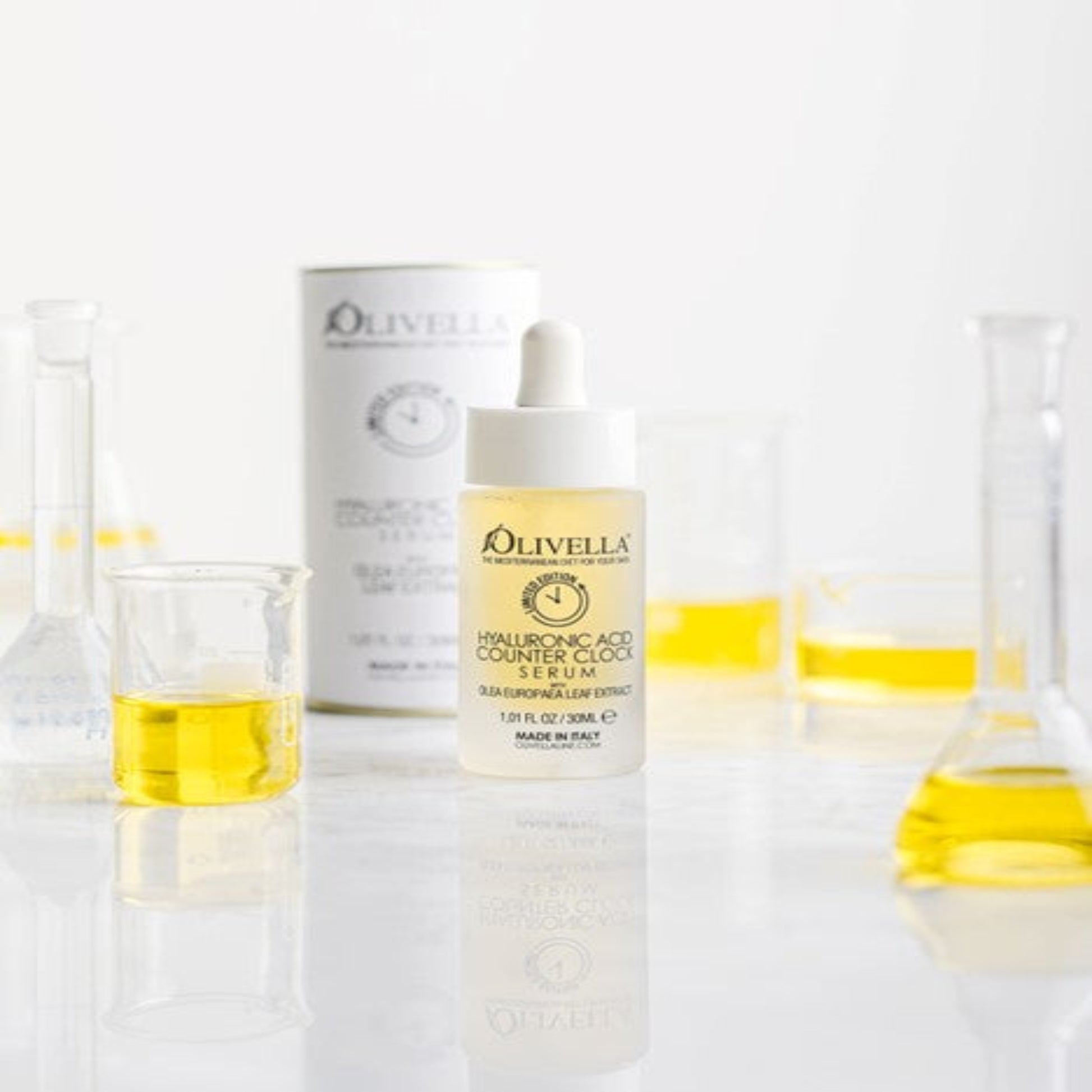 Olivella skincare products with a dropper bottle and box on a white background