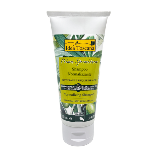 Tube of Idea Toscana shampoo with olive leaf design on a white background